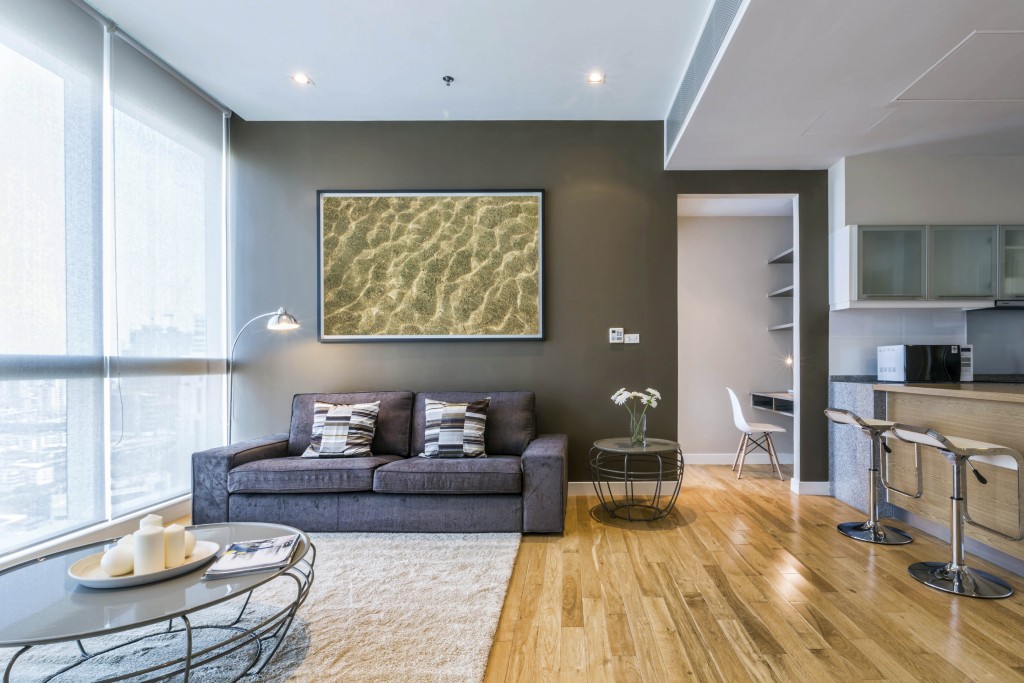 living room with big window and brown wall interior